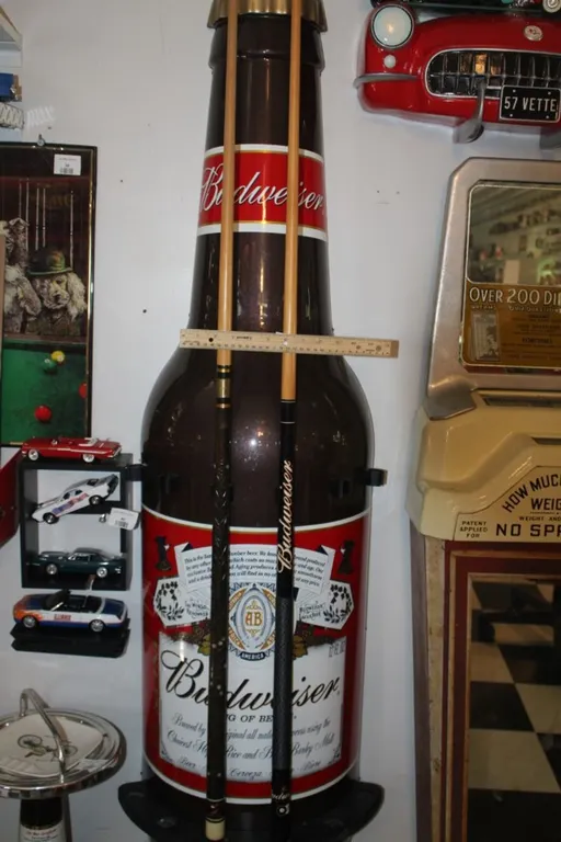Budweiser Cue Stick Rack with a Budweiser Cue Stick and an Inlaid Carved Cue Stick Rack Is 57 Inches Tall