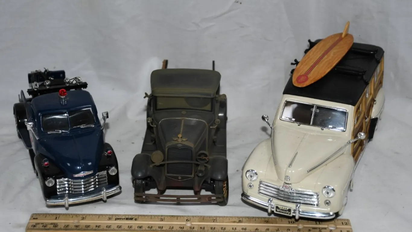 Three 1/18 Scale Diecast Models: 53 Chevy Wrecker Thunder Towing, 31 Ford Model A,