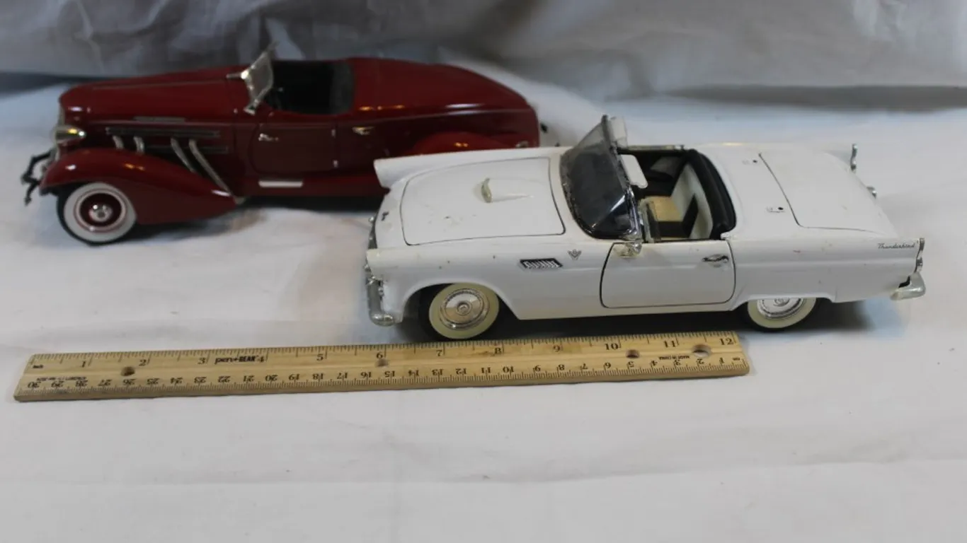 Two Diecast Cars, 1:18 Scale Road Tough 55 Ford Thunderbird and 1935 Auburn Boat Tail Roadster, Damage to Both Bumpers