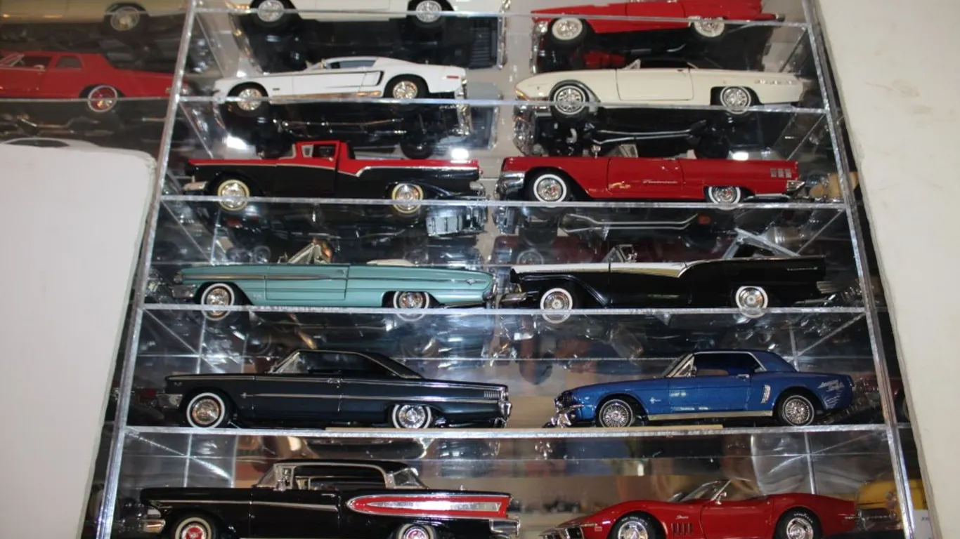 Plexiglass Display Cabinet with 12 1:18 Scale Diecast Models, Including a 1969 Chevy Corvette, 1958 Edsel Citation, 1963 Ford Galaxie 500, 1964 and a