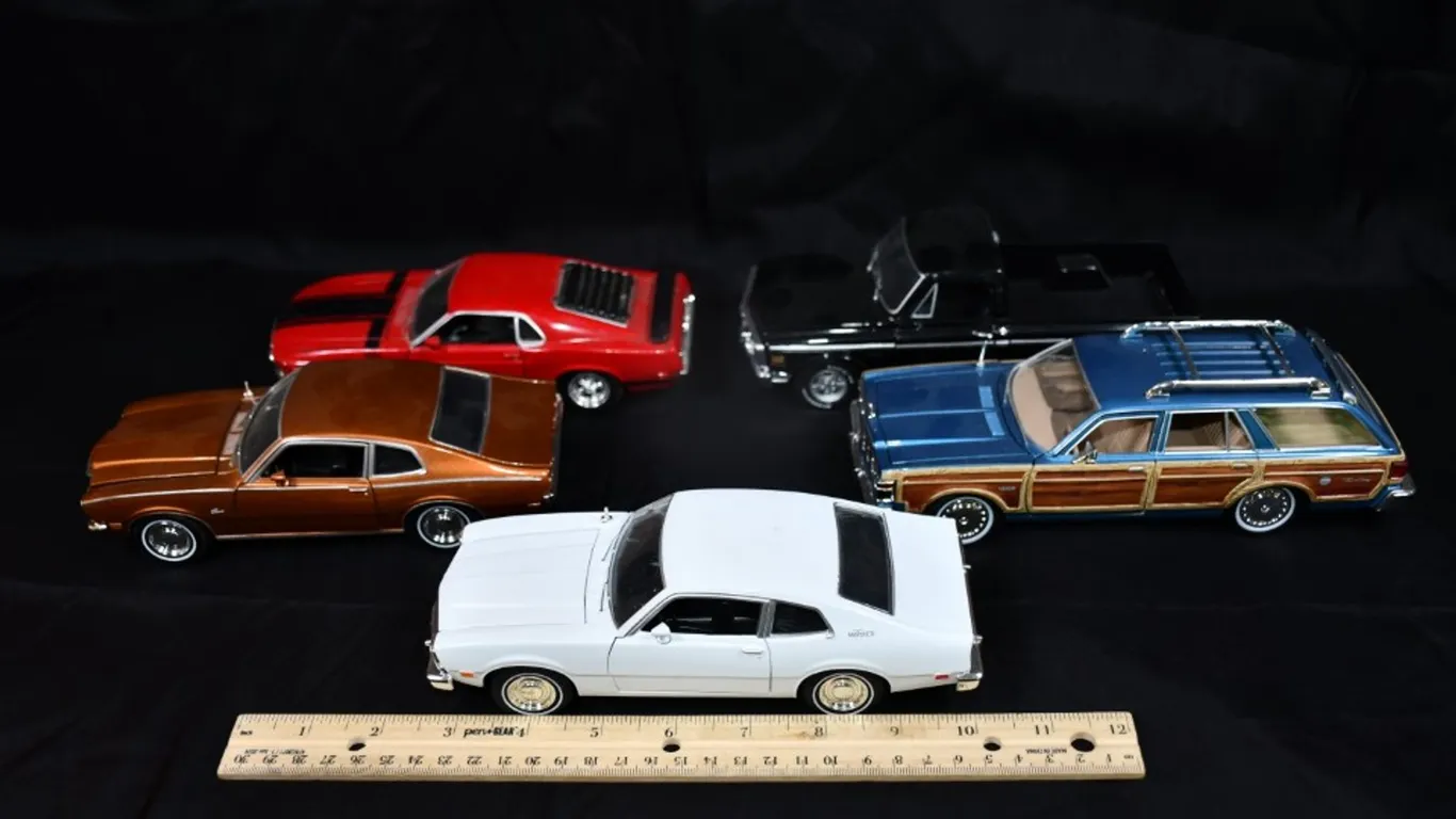 Five 1:24 Scale Diecast Models: 1970 Ford Mustang, 1972 Chevy C10, 1979 Chrysler LeBaron Woody Wagon,