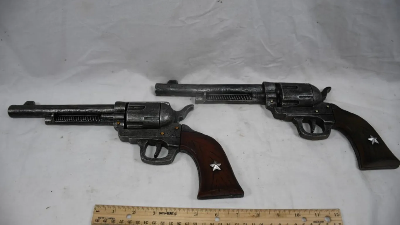 Two Revolver Wall Plaques