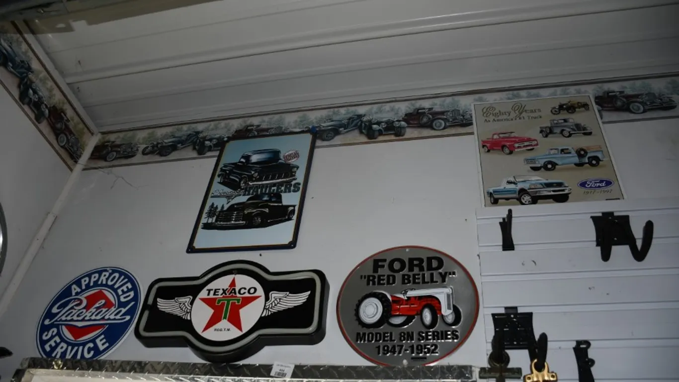 5 Automotive Related Signs: Classic Haulers, Ford Trucks, Ford Tractor, Packard Service, and a Light up Texaco Sign with No Power Cord