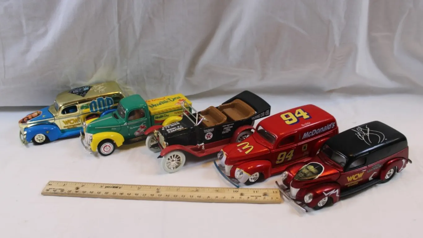 Four 1:24 Scale Diecast Cars, Three Winner's Circle Coupes, and a Ertl 1917 Touring Car