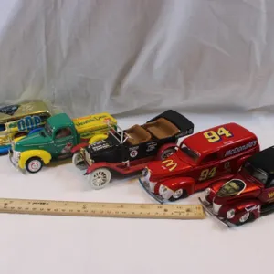 Four 1:24 Scale Diecast Cars, Three Winner's Circle Coupes, and a Ertl 1917 Touring Car