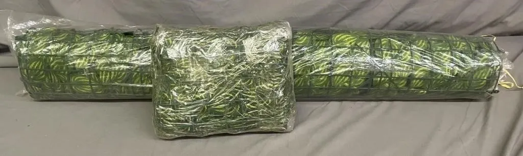 Two packages of artificial ivy privacy fence