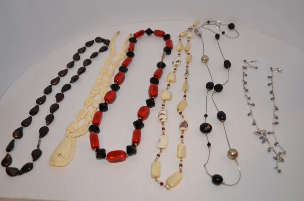 Five distinct vintage necklaces, including a