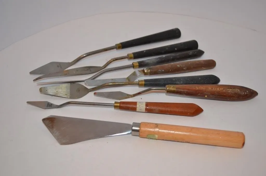 Artist’s palette and painting knives featuring