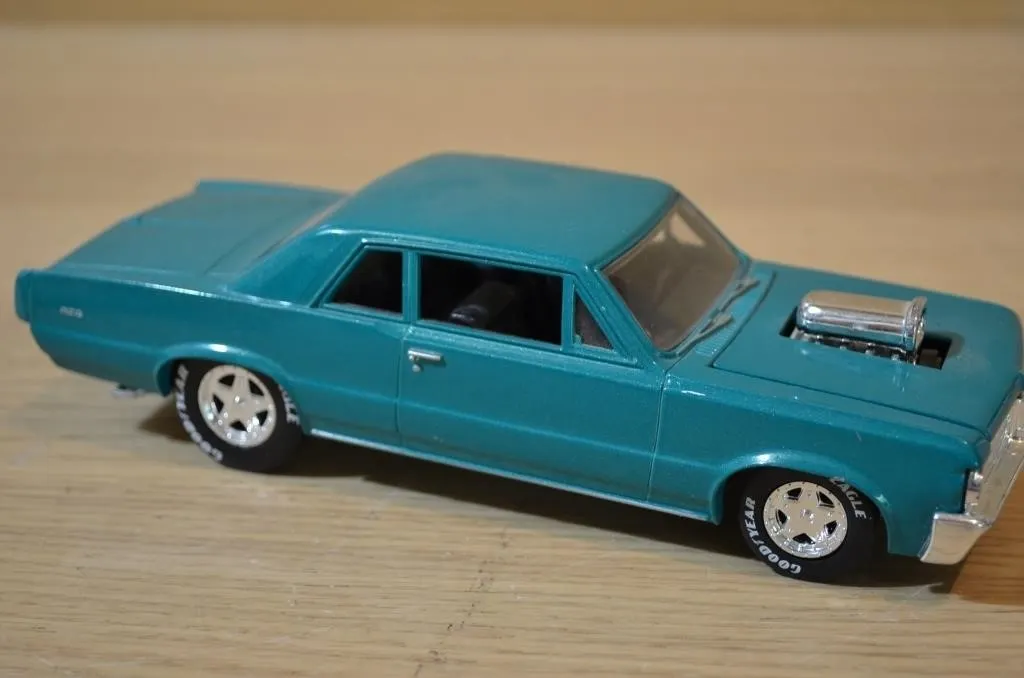 Metallic teal 1/18 scale diecast model of a 1964