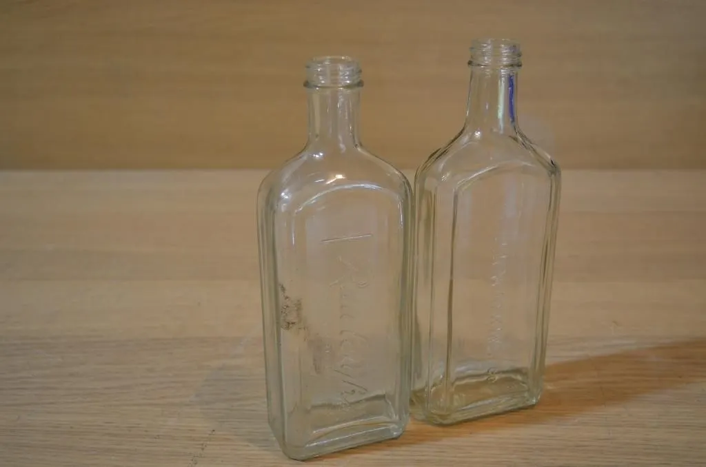 2 lot embossed medicine/apothecary bottles from