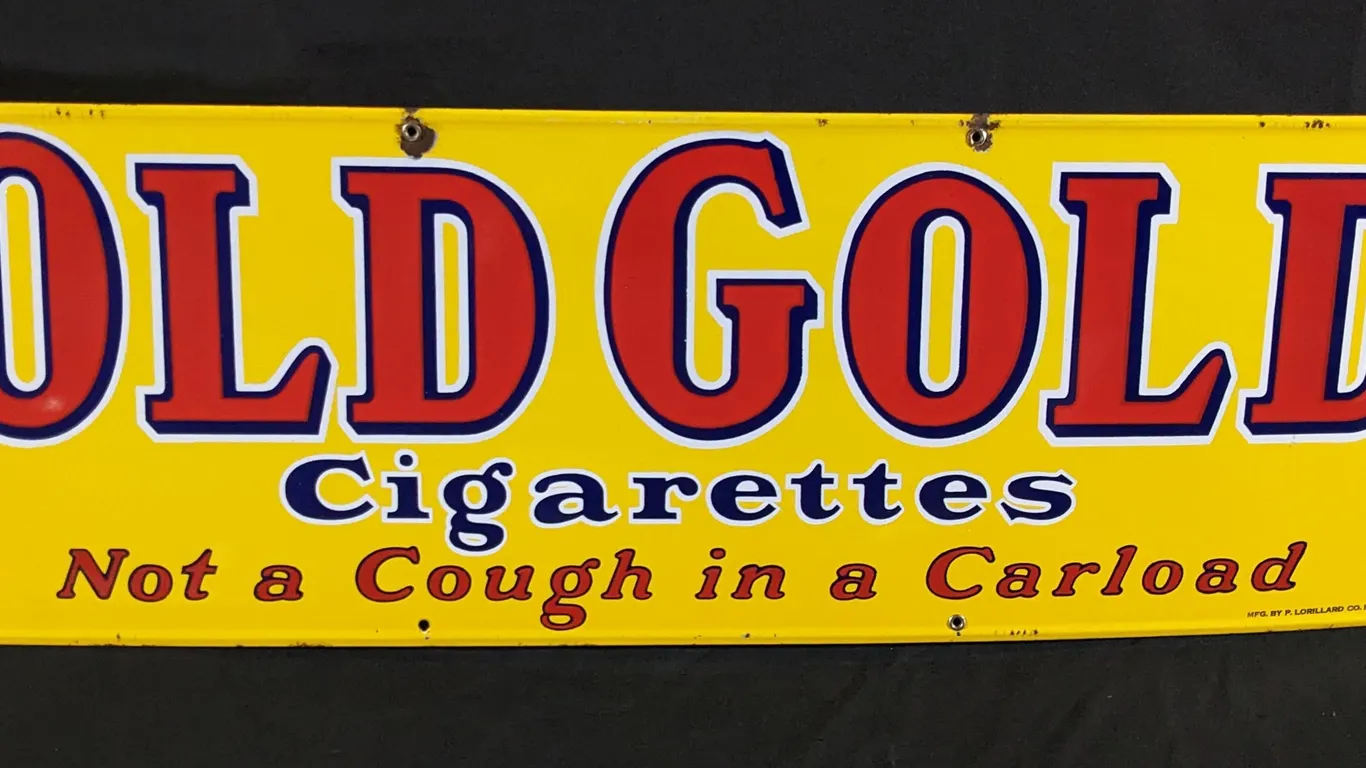 PORCELAIN SIGN OLD GOLD CIGARETTES NOT A COUGH IN A CARLOAD