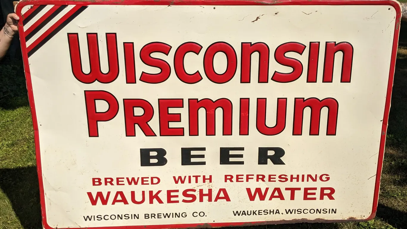 EMBOSSED TIN SIGN WISCONSIN PREMIUM BEER WAUKESHA WISCONSIN