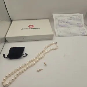 Vintage 18 inch, 7 mm strand pearls with pearl stud earrings.