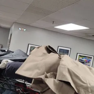 Clothing Lot from Top Shelf of the 3rd Cart Including Shirts, Jackets, and Coats in Multiple Colors