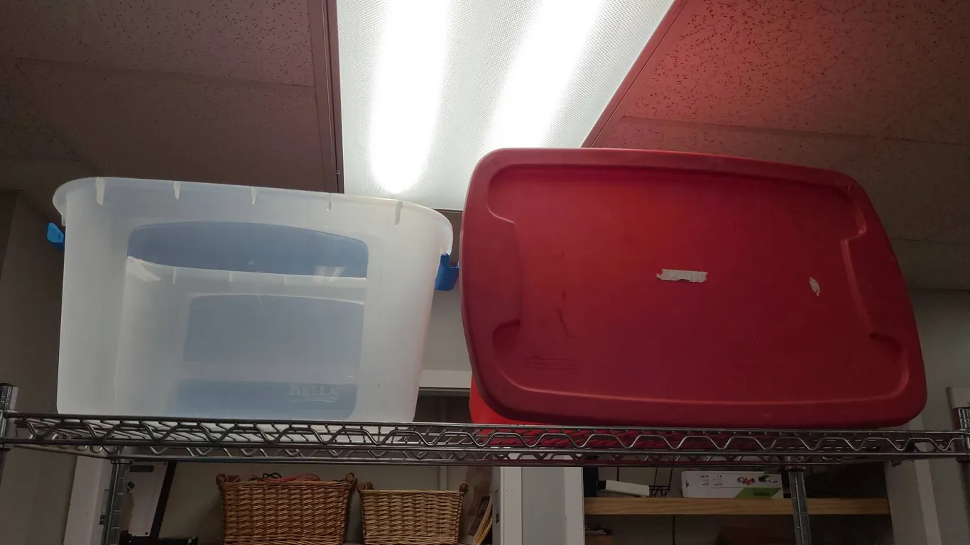 Storage Totes Including Bella Plastic Bin and Red Sterilite Container from Top Shelf of 2nd Cart
