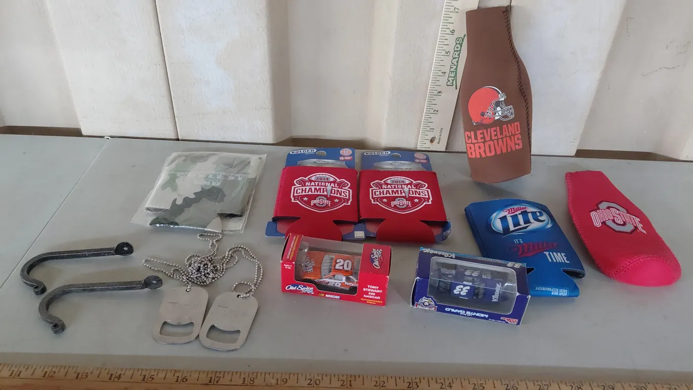 2 Metal Wall Hooks, 2 Diecast Nascars, Assorted Koozies, & 2 Bottle Openers