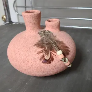 Southwestern-Style Double-Spouted Pink Speckled Pottery Vase with Beaded Leather and Feather Adornme