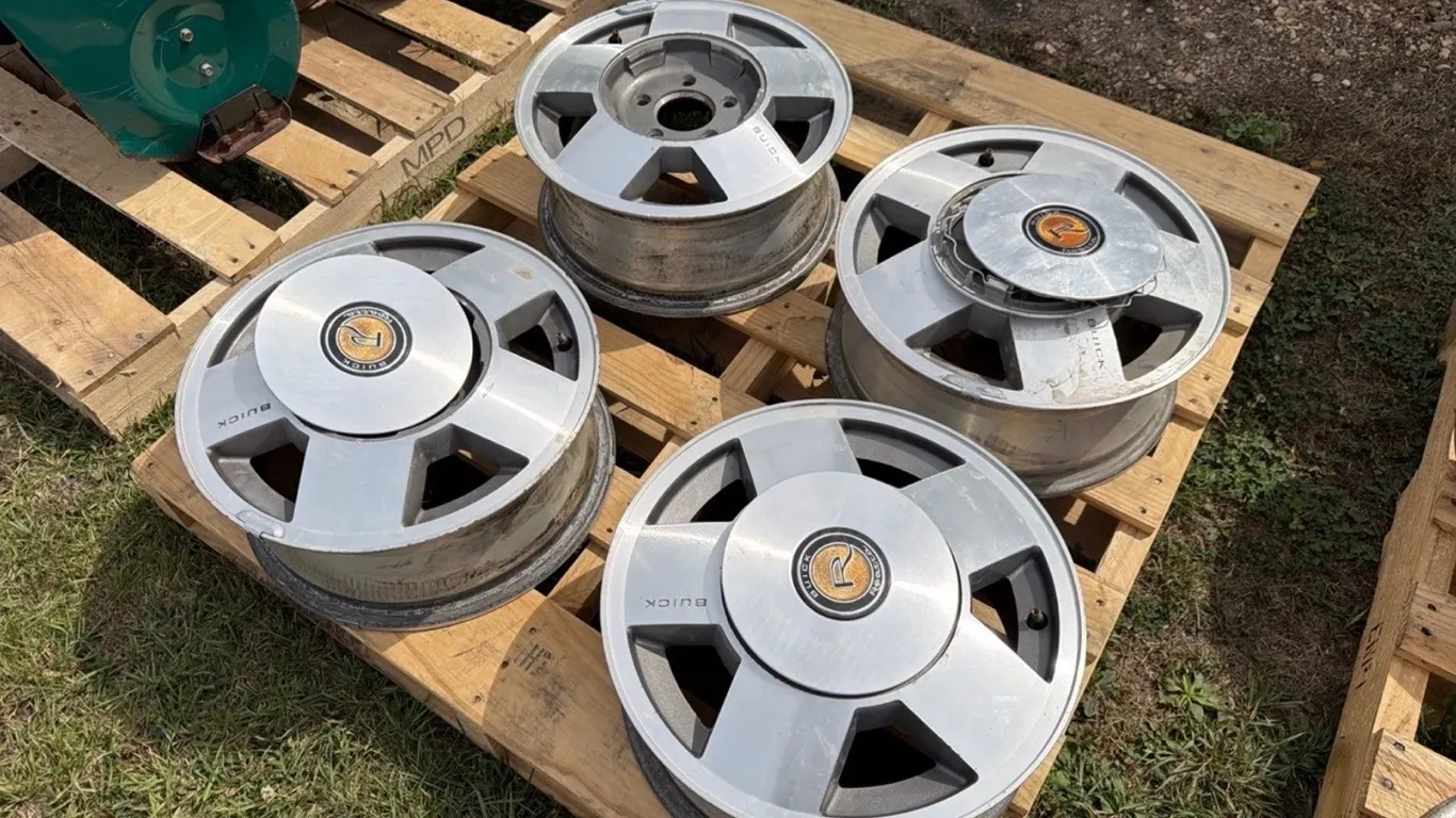 4) Buick 15” 5-bolt factory wheels w/ hubcaps