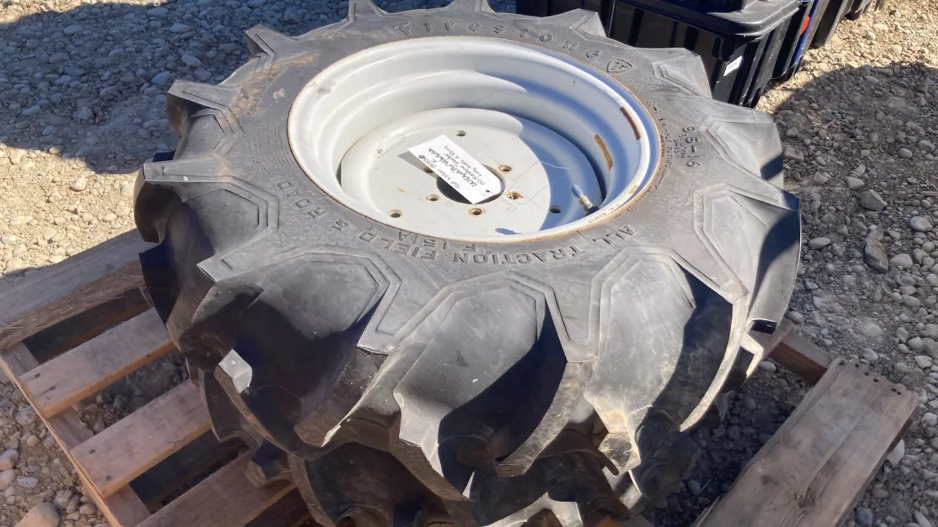 (2) Firestone 9.5-16 with 6 Bolt Rims Traction Lug Tires