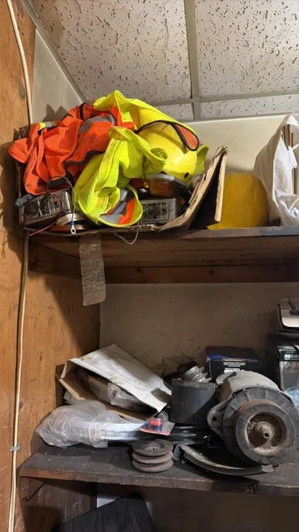 Contents of room include semi exhaust parts, break parts, shop sundry lights , safety vests etc