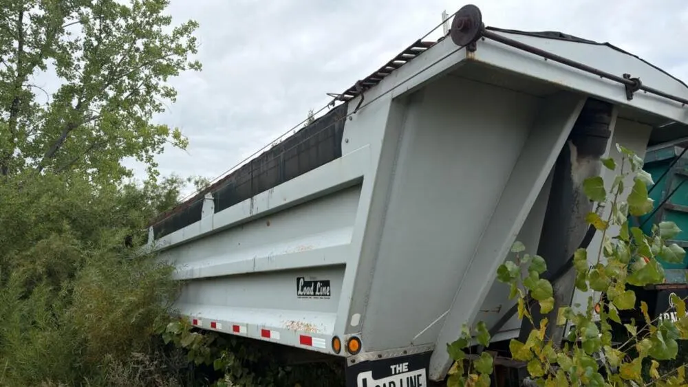 Load line tandem axle end dump gravel trailer