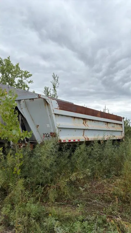 Load line end dump tandem trailer