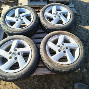 4 Mazda 3- 16" rims with Rovelo RPH778 M+S 205/55R6 91H Tires