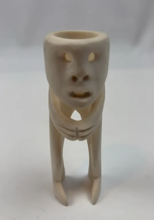 Hand Carved Bone Figure Vessel with Tribal Face Motif