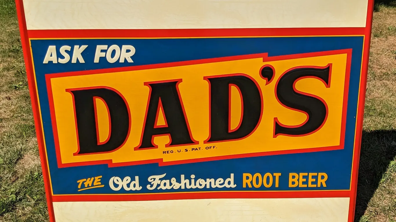 NOS EMBOSSED TIN SIGN ASK FOR DAD'S THE OLD FASHIONED ROOT BEER
