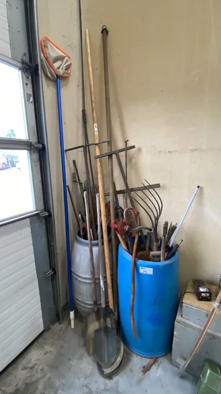 2 BARRELS OF ASSORTED SHOVELS, PRESSURE WASHER WANDS, GOON SPOONS, HAND CRANK PUMP, DIP NET, WEED