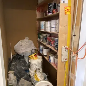 CONTENTS OF CLOSET- ASSORTED PAINTS, STUCCO, PAINTERS TAPE & MORE