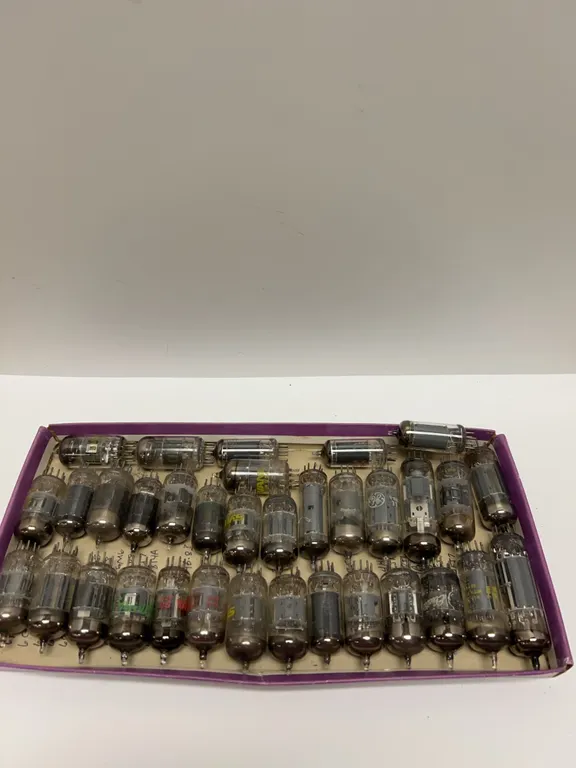 29 Vacuum Tubes in Box Including Brands such as RCA, Sylvania, and GE with Mixed Types