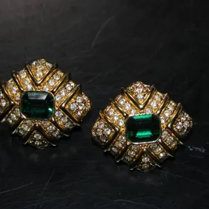 Gold Tone Clip-On Earrings Featuring Green Central Stones and Pave-Set Clear Stones in Geometric Mot