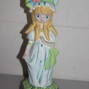 Hand-Painted Ceramic Figurine Signed PAM F Depicting Blond Girl in Bonnet with Flowers and Green Acc