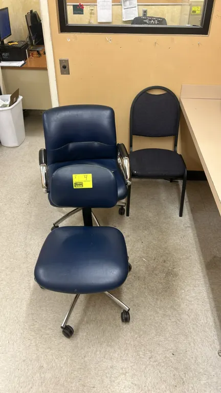 Assorted office chairs. Includes blue vinyl rolling task chairs with caster bases and a fabric stationary side chair with a black metal frame. Note: B