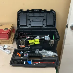 Poly tool box with removable tote tray and contents. Includes tape measure, partial drive socket set with organizer, power cord, and miscellaneous har
