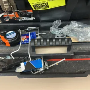 Poly tool box with removable tote tray and contents. Includes tape measure, partial drive socket set with organizer, power cord, and miscellaneous har