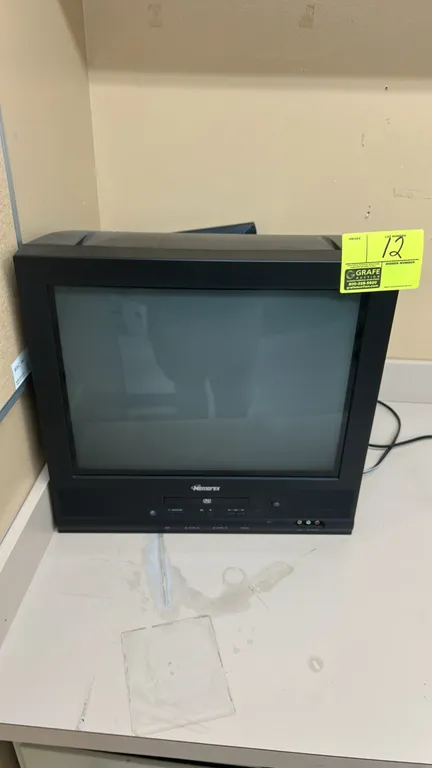 Memorex 20" CRT television. Features built-in DVD player, front control panel, and front composite AV inputs.