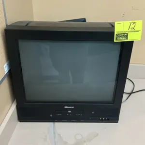 Memorex 20" CRT television. Features built-in DVD player, front control panel, and front composite AV inputs.