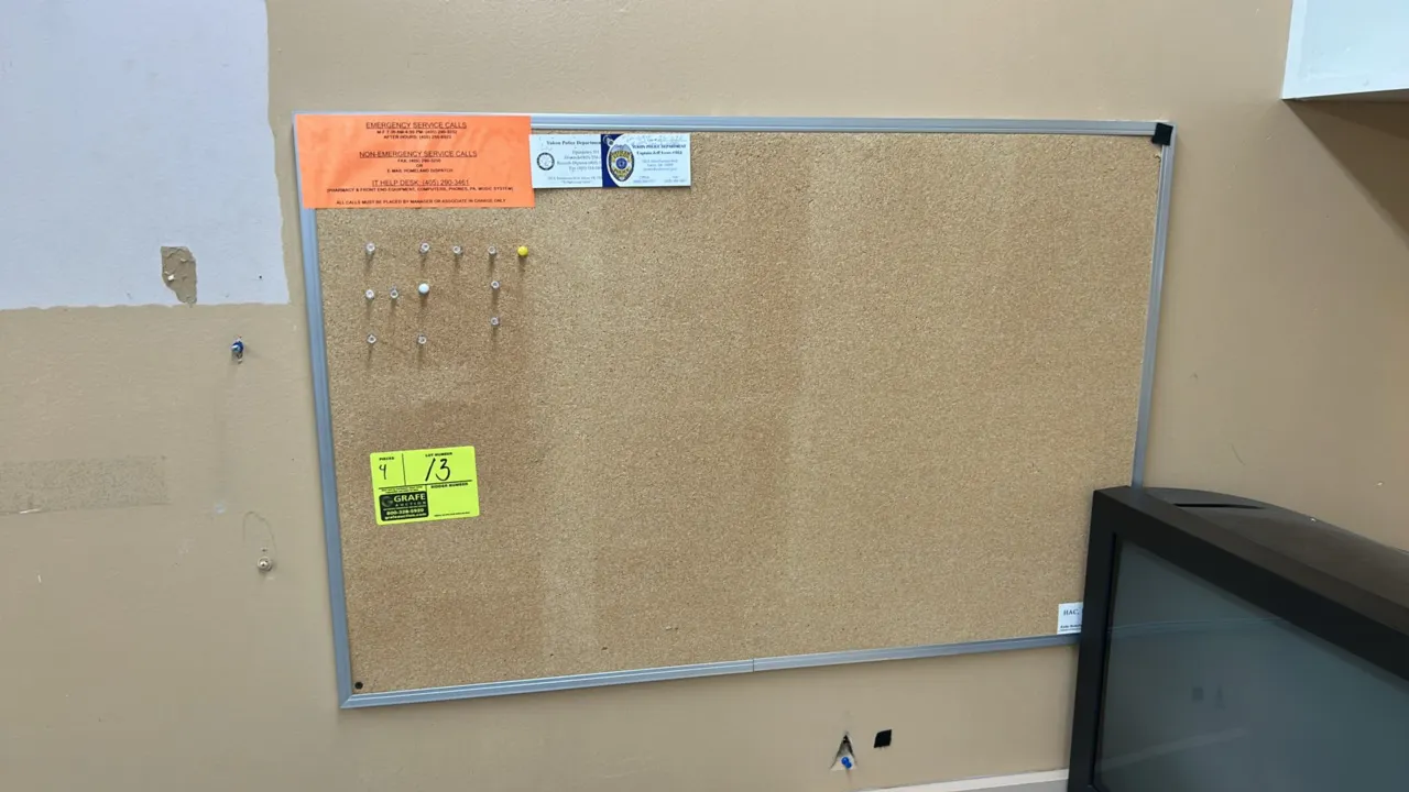 Cork bulletin boards. Features assorted aluminum and wood frames with natural cork surfaces. 3' x 2' each. Wall mountable. Contents and surrounding fi