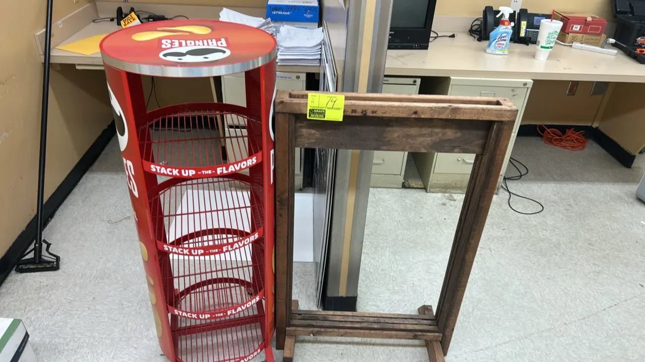 Wooden sign stand and Pringles portable multi-tier wire merchandiser. Includes 24"W wooden sign frame stand and round Pringles branded 4-tier wire dis