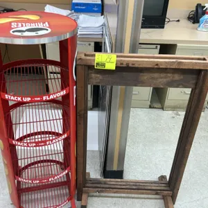 Wooden sign stand and Pringles portable multi-tier wire merchandiser. Includes 24"W wooden sign frame stand and round Pringles branded 4-tier wire dis