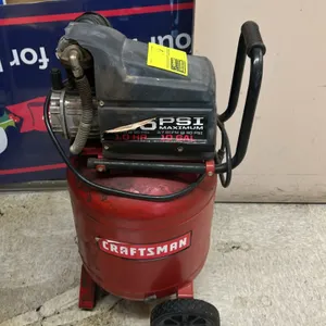 Craftsman 10-gallon portable vertical air compressor. Features 1.0 HP motor, 3.7 SCFM at 40 PSI rating, pressure gauge, integrated transport handle, a