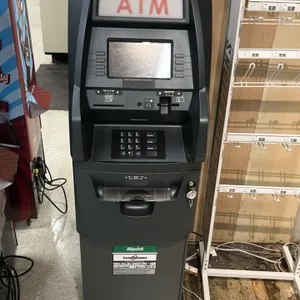Triton Traverse retail ATM machine. Features illuminated ATM topper, color display screen, numeric PIN pad, card reader, receipt printer, and cash dis