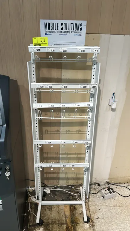 Two-sided metal mobile display merchandiser. Features multi-tier adjustable wire hook racks with integrated price tag channels, "Mobile Solutions" hea