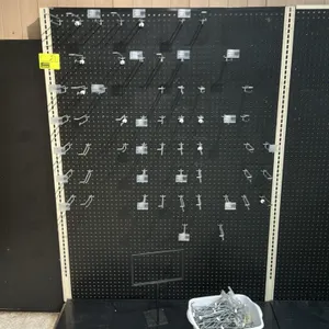 8'L of Lozier wall shelving. 72"H uprights with 19"D base shelves. Features black pegboard backing. Note: Sold by the foot.