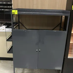 Metal multi-tier display rack cabinet. Features a 2-door lower storage compartment, top storage tier, and side-mounted 4-tier wire basket shelving. Gr