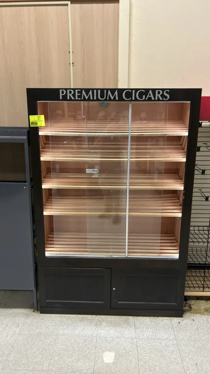 Wooden multi-tier cigar display merchandiser. Features sliding glass doors, slatted display shelving, 'PREMIUM CIGARS' header, and a 2-door lower stor