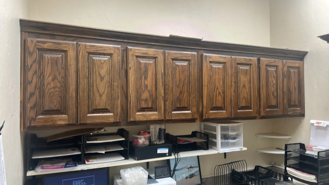 Office cabinetry and countertop suite. Includes 8' x 6' L-shaped laminate countertop with base cabinets, 8' overhead wall cabinets, tall storage cabin