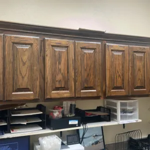 Office cabinetry and countertop suite. Includes 8' x 6' L-shaped laminate countertop with base cabinets, 8' overhead wall cabinets, tall storage cabin